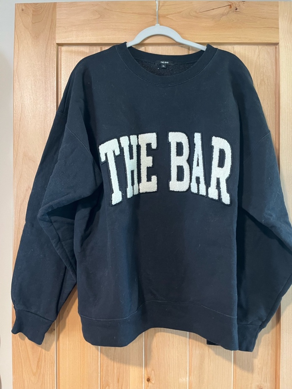 THE BAR Black Crewneck Sweatshirt with Cream Sherpa Lettering